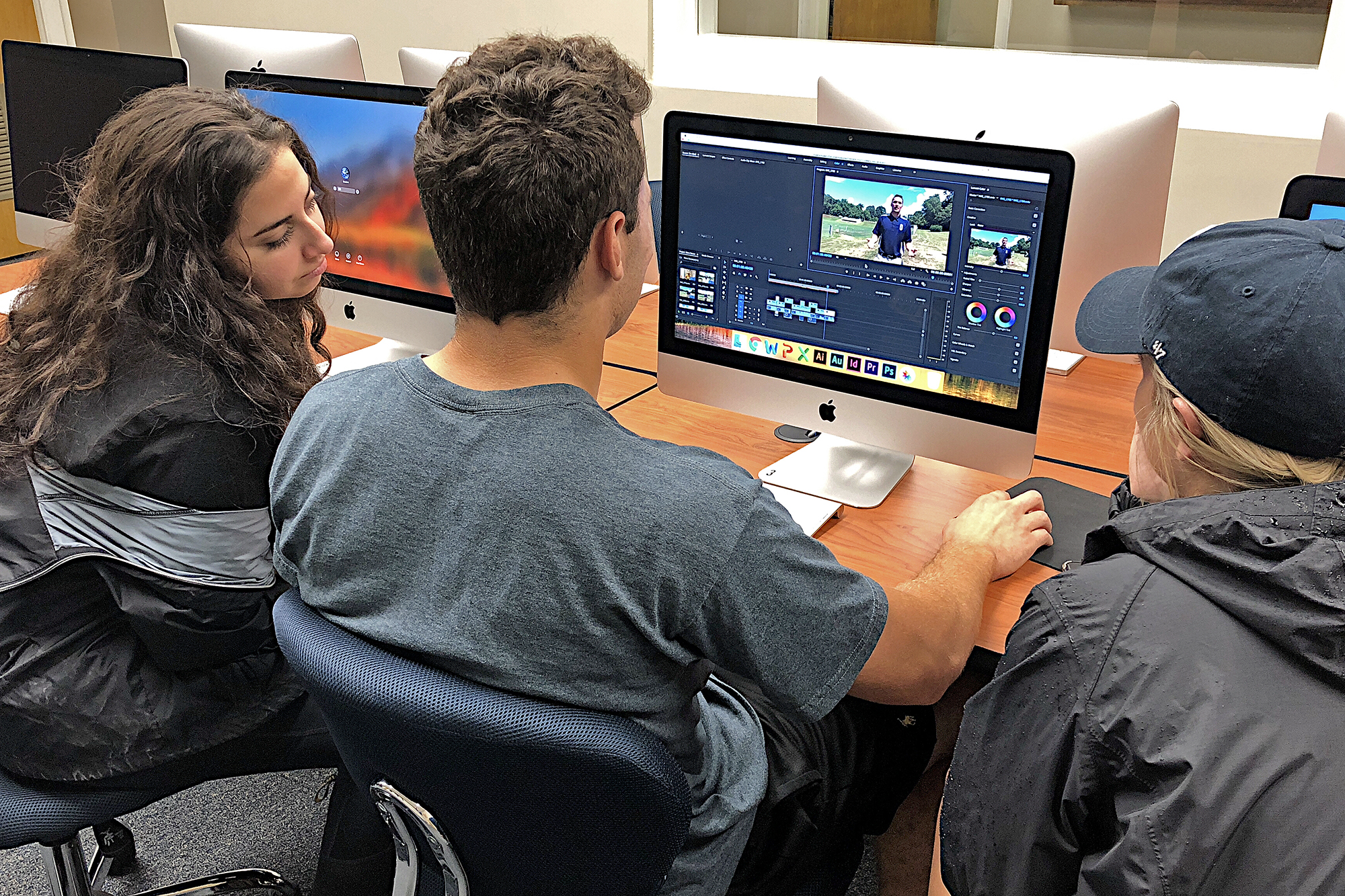 Students working on Adobe Premier in the Media Lab