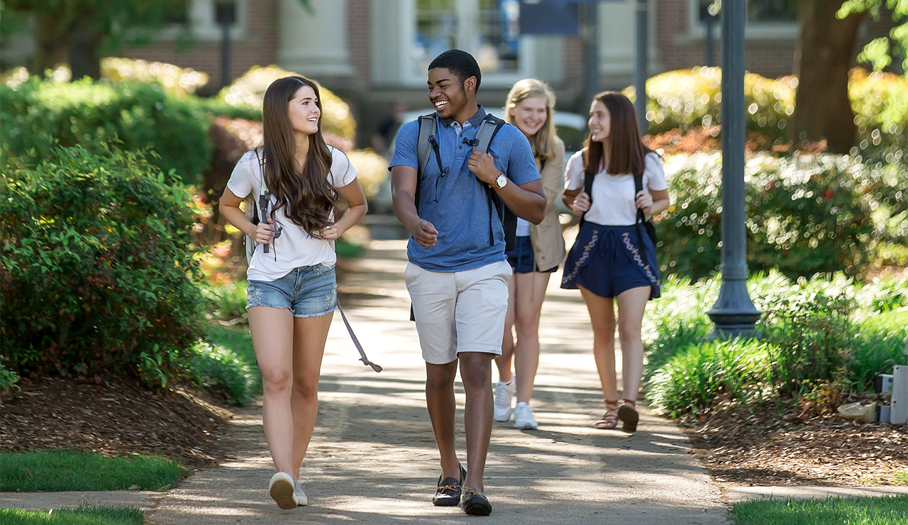 Photo of Students walking along MC's campus