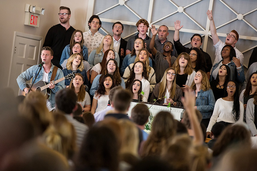 Students singing in chapel